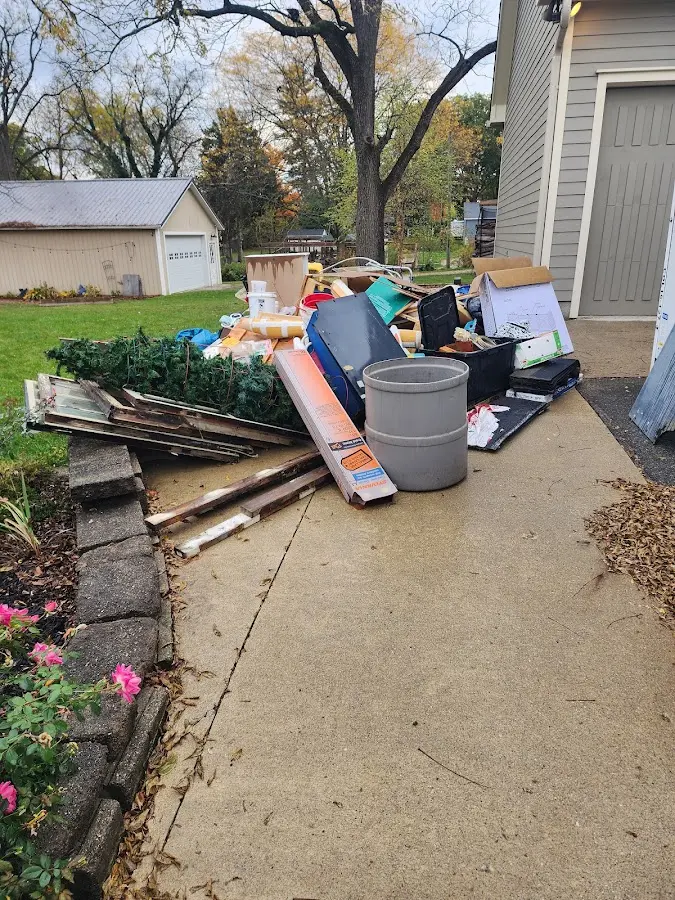 Dumpster being loaded with debris for Commercial Dumpster Rental in Strawberry Plains